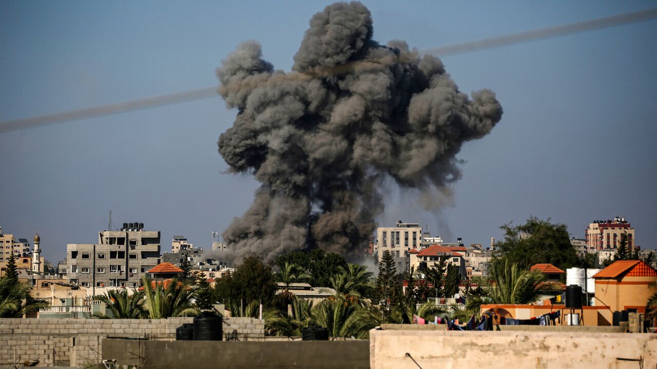 Smoke billows following Israeli bombardment in Nuseirat in the central Gaza Strip on August 11, 2024, amid the ongoing conflict between Israel and the Palestinian militant group Hamas.